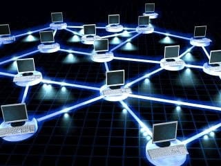 Modern network cabling setup with connected laptops and devices for optimal data transfer.