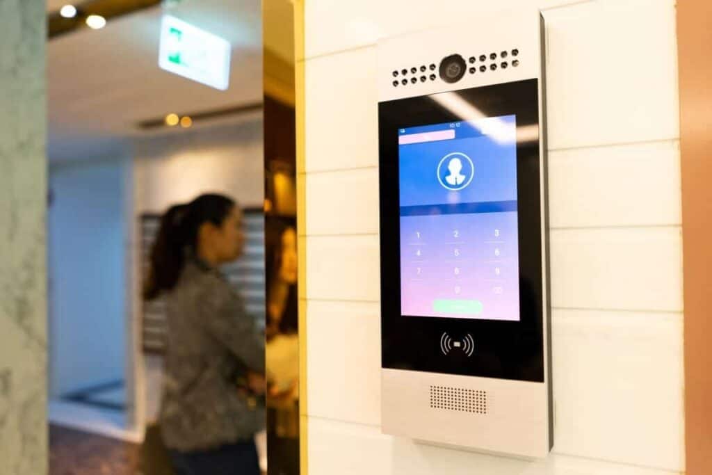 Modern digital building access control system with keypad and camera.