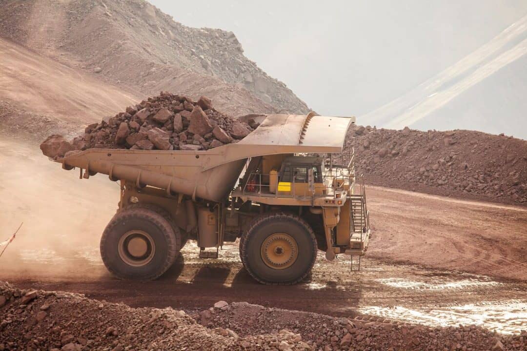 Mining haul truck at a quarry site, representing RM Gold's mining industry