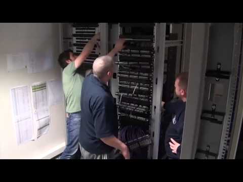 ACCL engineers rebuilding network cabinet connections during the Southampton FC cabling tidy project