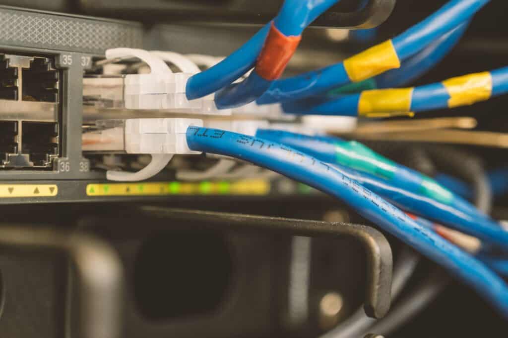 Close-up of network cables connected to a patch panel in a data centre.