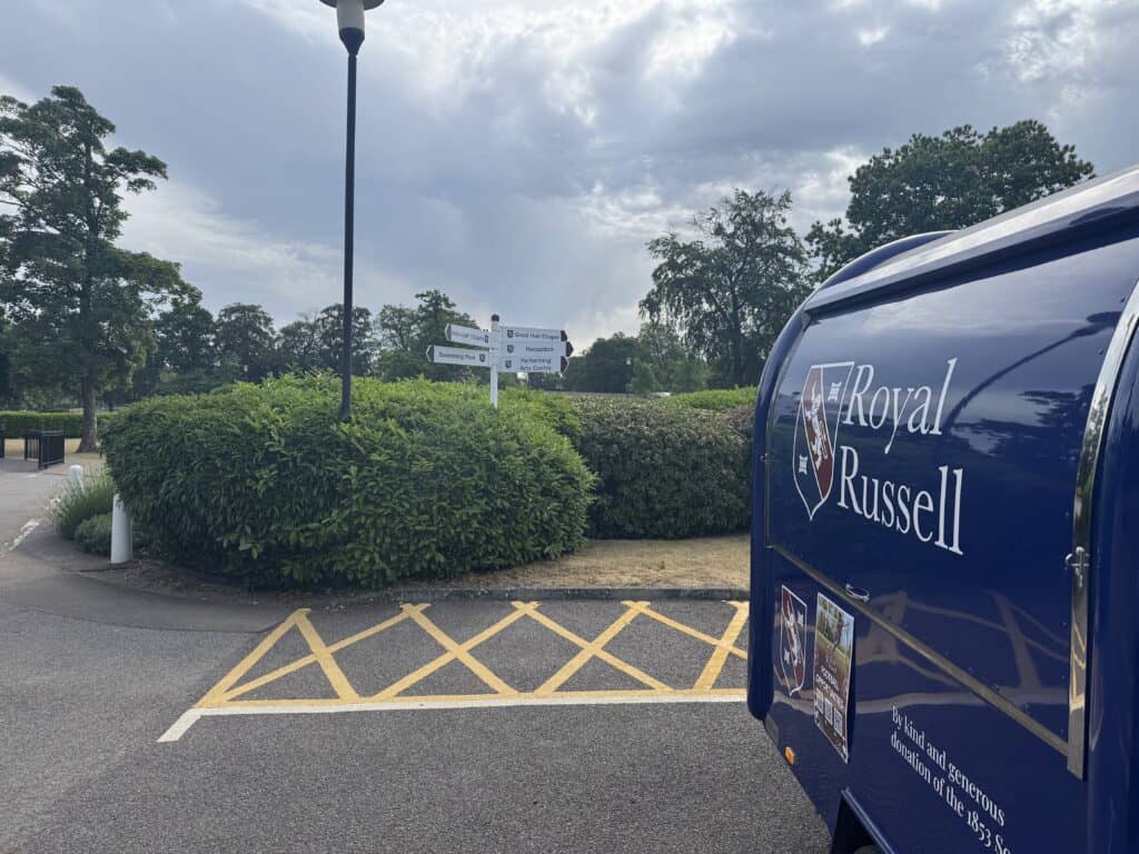 ACCL liveried van parked beside campus wayfinding signage at Royal Russell School, Croydon
