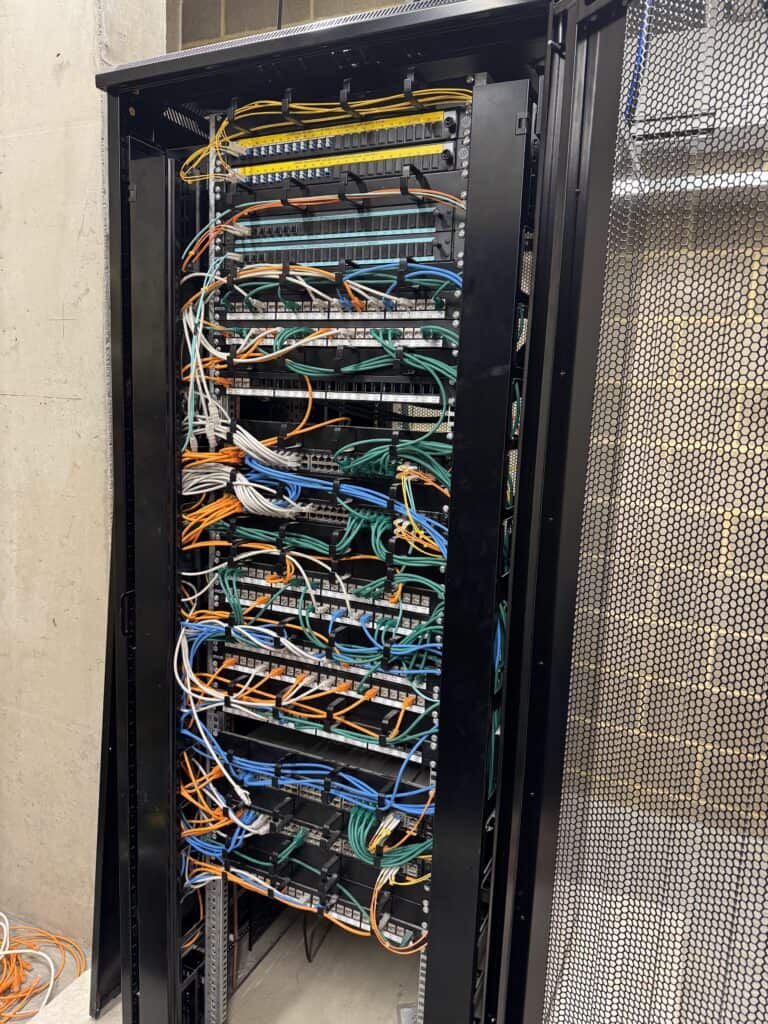 Fully populated and cable-managed 42U comms cabinet installed at Royal Russell School's new junior school building