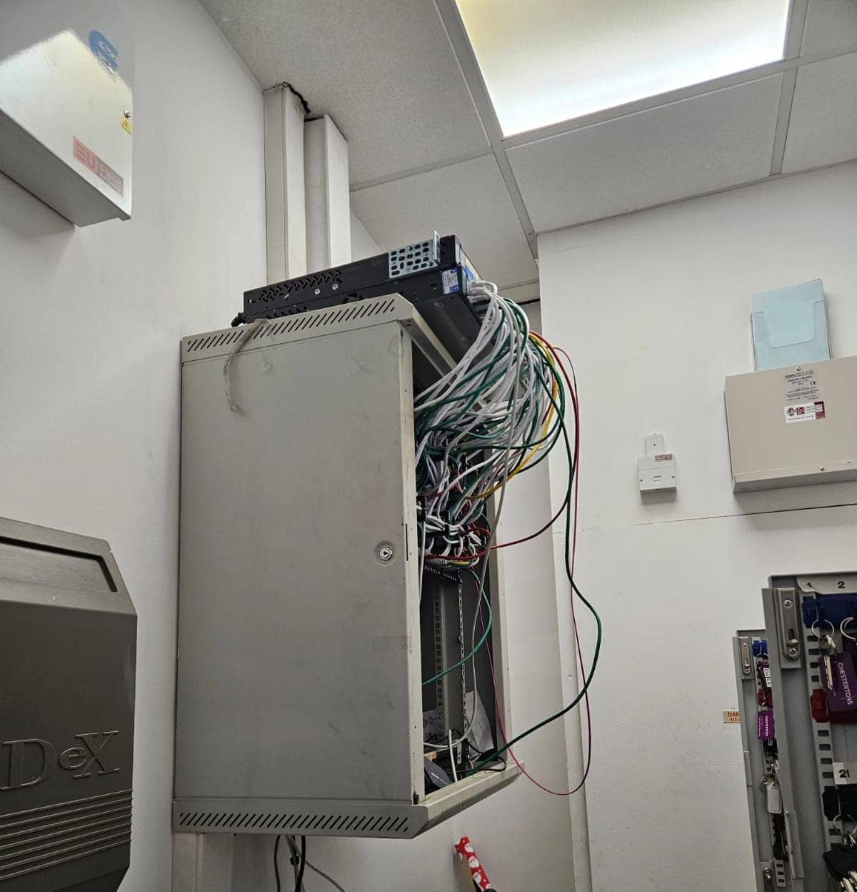 Legacy comms cabinet before ACCL's upgrade at Chestertons' Canary Wharf branch