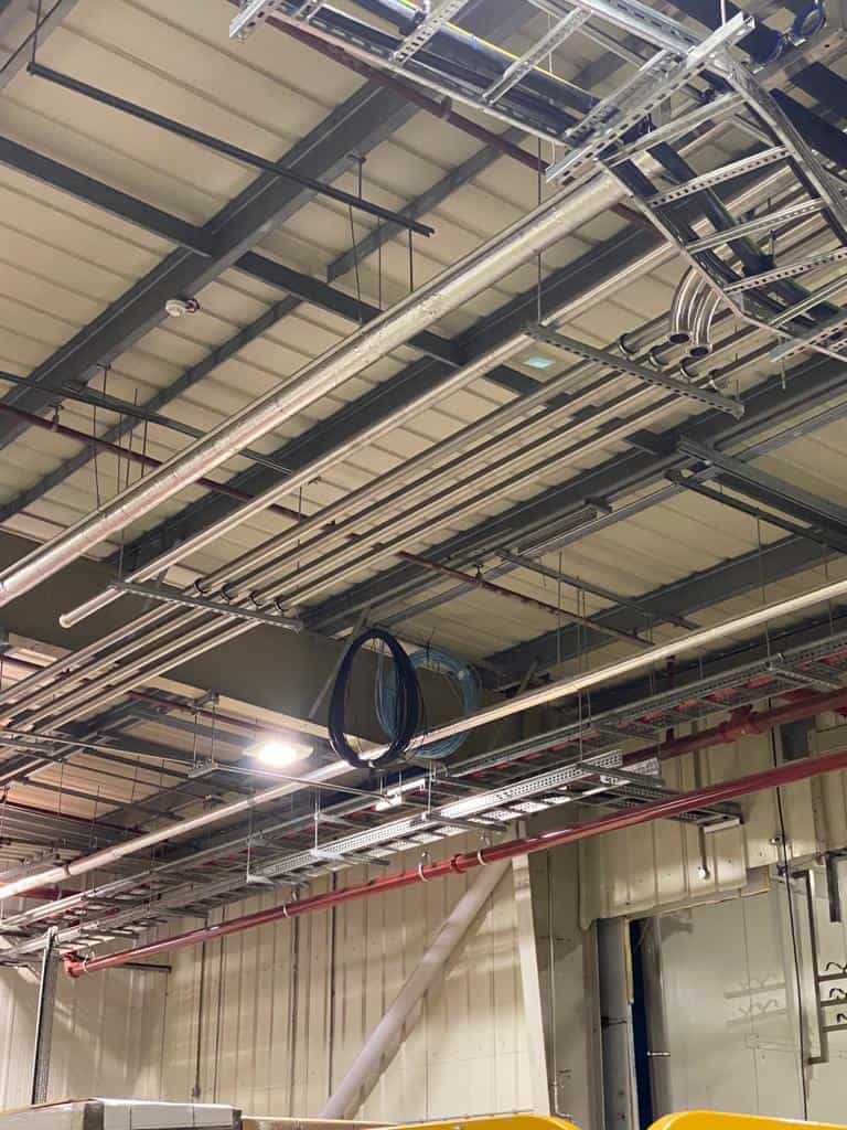 Overhead cable containment and fibre routes within DHL’s East Midlands Airport distribution facility, installed by ACCL