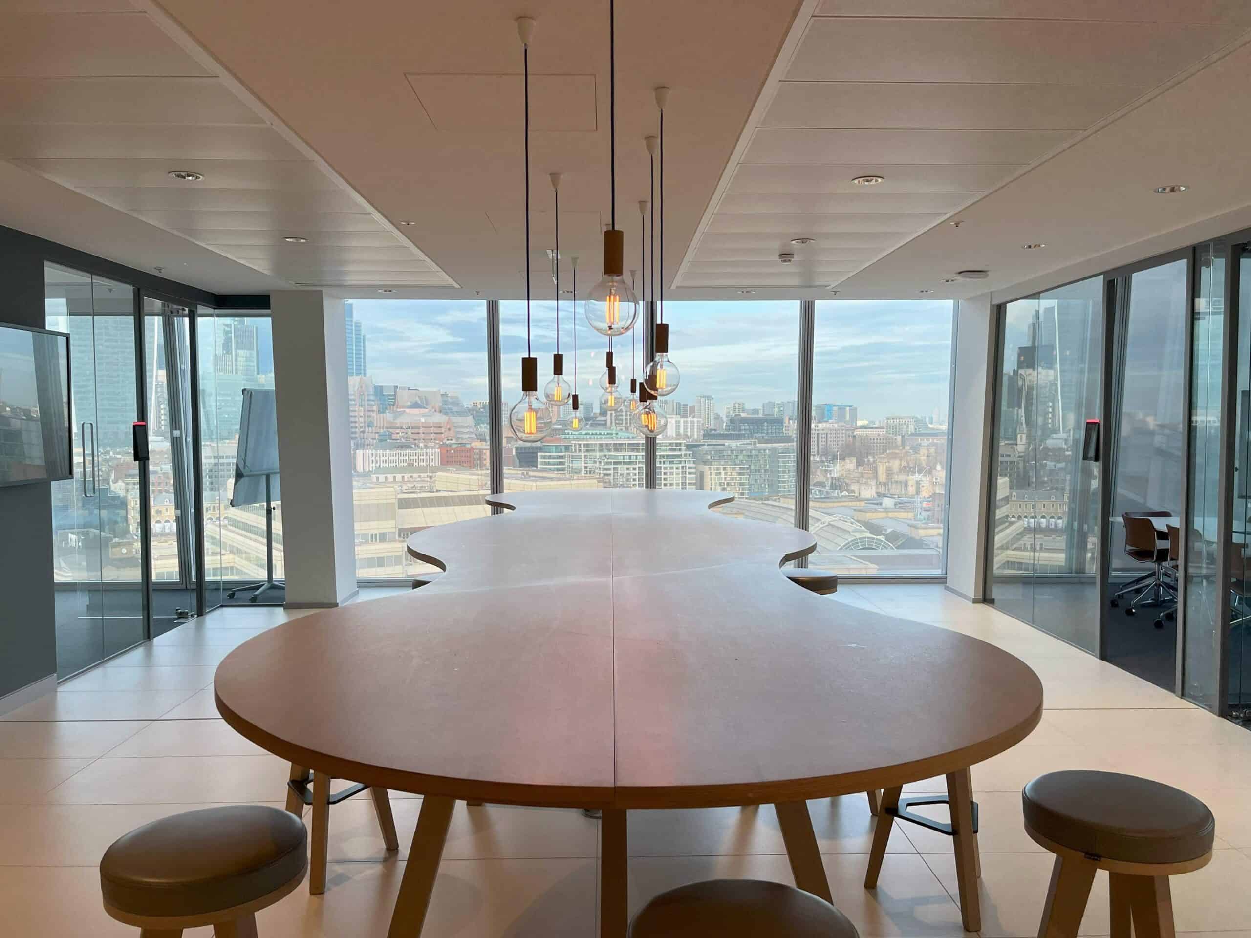Meeting and collaboration space in Foresight Group's Level 23 office at The Shard, London, with door access control reader visible on the glass partition