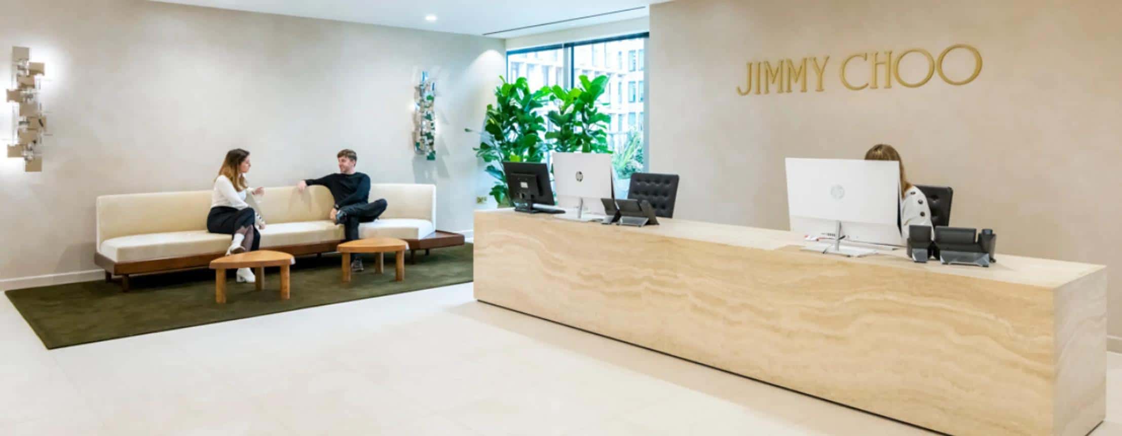 Jimmy Choo reception desk and branded wall at the company's Victoria, London headquarters