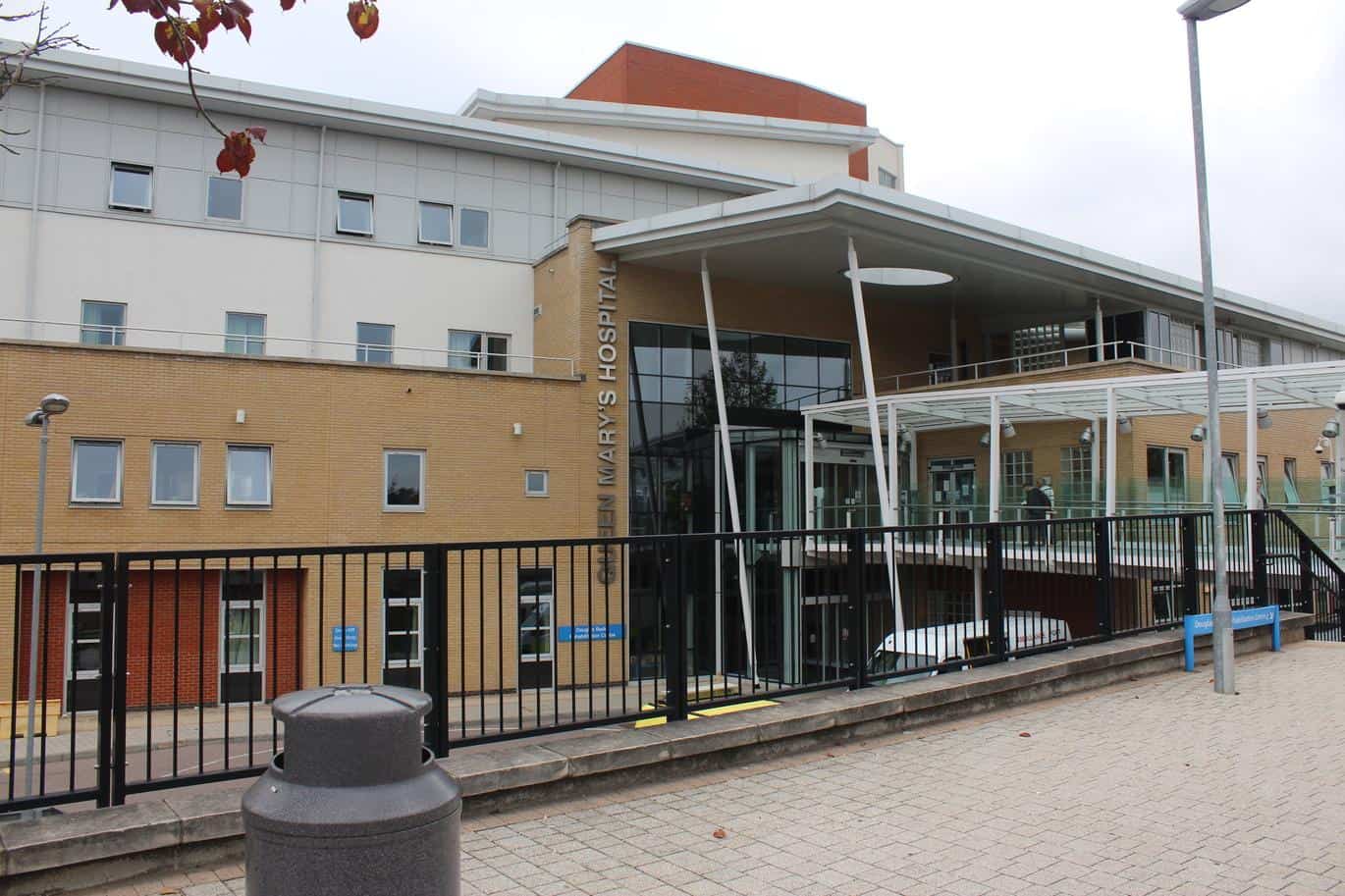 Main entrance of Queen Mary's Hospital, Roehampton, with building signage