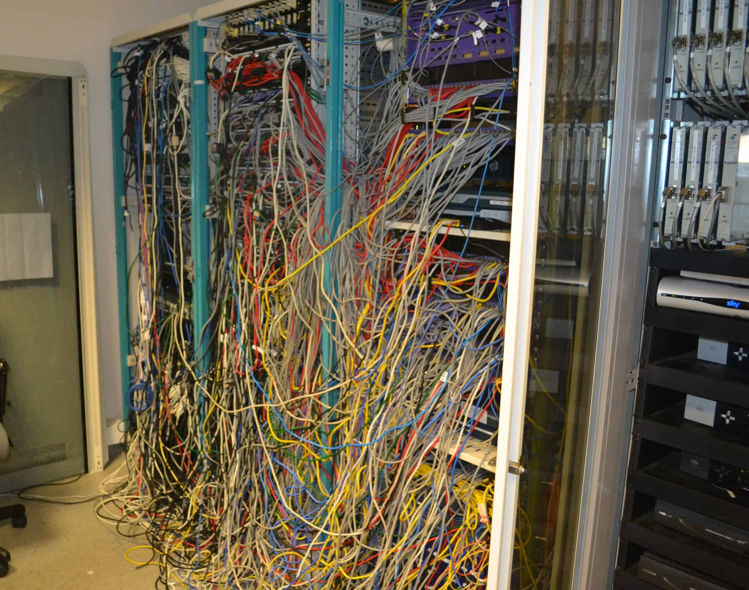 Southampton FC's stadium communications cabinet before rationalisation, illustrating the network challenge inherited at St Mary's