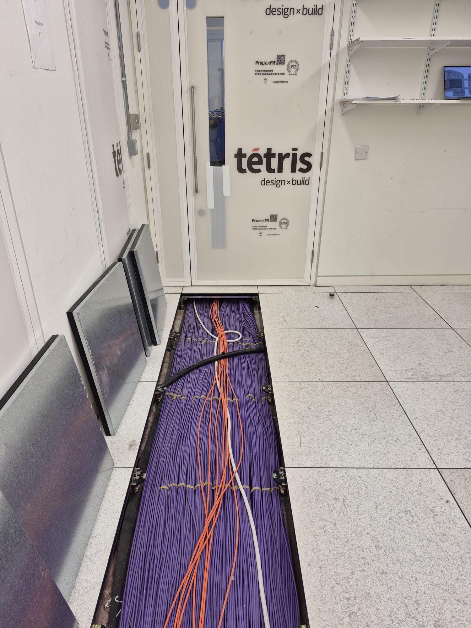 Structured Cat6A and fibre cabling installed under the raised access floor at 20 Water Street, Canary Wharf