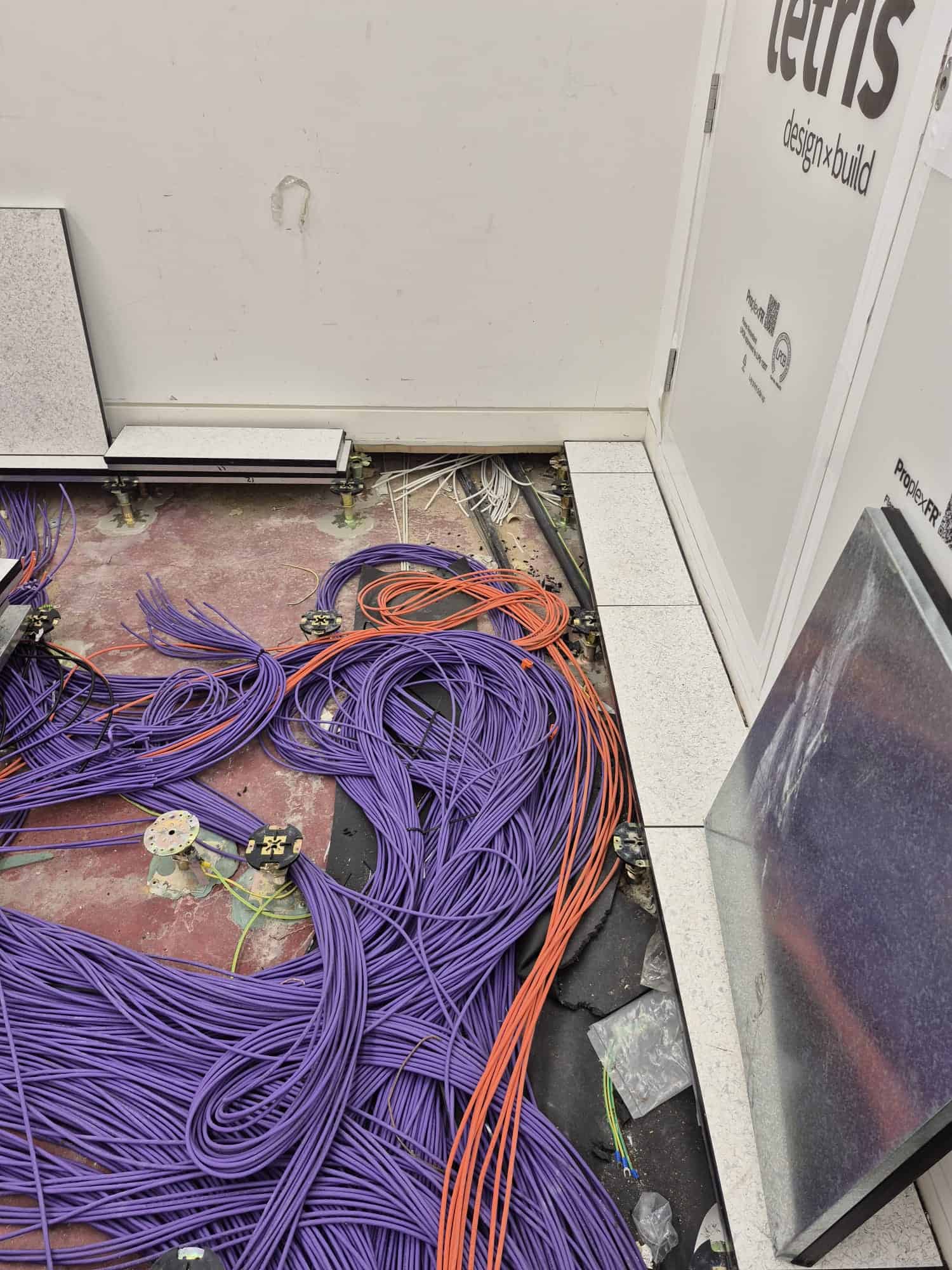 Equipment room fit-out in progress at 20 Water Street, Canary Wharf, ahead of cabinet and cabling installation